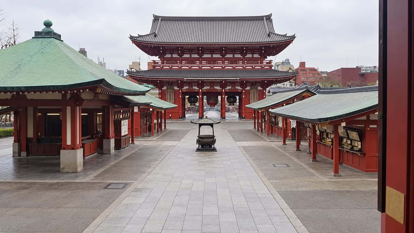 The red Hozomon gate and incense burner across the courtyard of Senso-ji in Asakusa, Tokyo